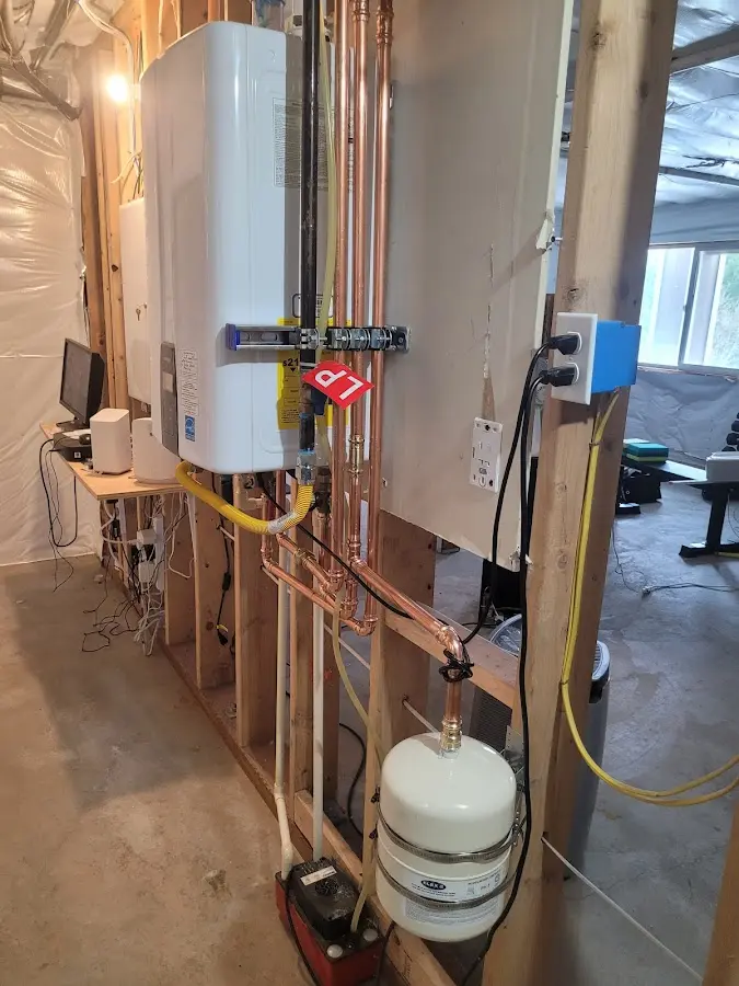 Licensed plumber repairing a kitchen sink in Gates